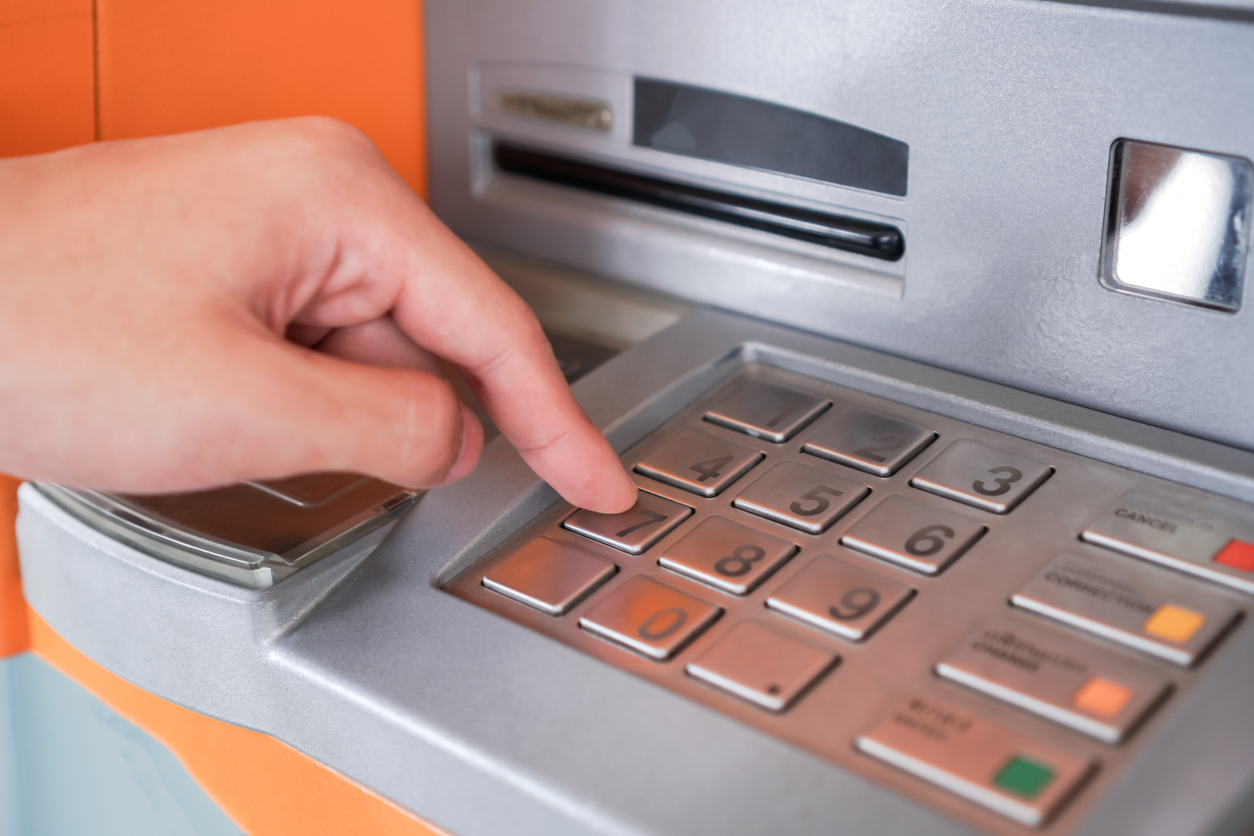 Press ATM PIN, Finger entering PIN pass code on Bank Machine Keypad. Automated teller machine is electronic telecommunications device that enables customers of financial institutions to transactions